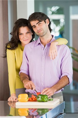 simsearch:6108-05863298,k - Man cutting bell pepper and smiling Stock Photo - Premium Royalty-Free, Code: 6108-05862506