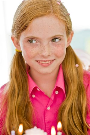 Close-up of a girl celebrating her birthday Stock Photo - Premium Royalty-Free, Code: 6108-05862695