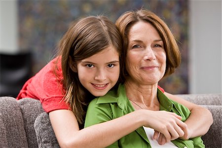 simsearch:6108-05858176,k - Girl hugging her grandmother from behind Stock Photo - Premium Royalty-Free, Code: 6108-05862760