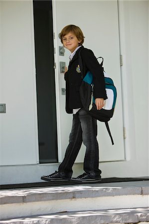 door education - Portrait of a schoolboy opening the door of a school Stock Photo - Premium Royalty-Free, Code: 6108-05862769