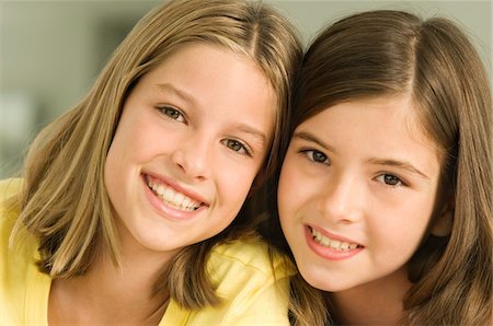 Portrait of two girls smiling Stock Photo - Premium Royalty-Free, Code: 6108-05862948
