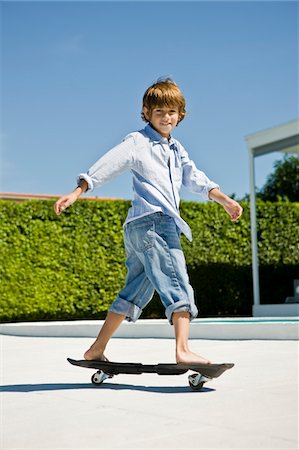 Boy skateboarding Stock Photo - Premium Royalty-Free, Code: 6108-05863005