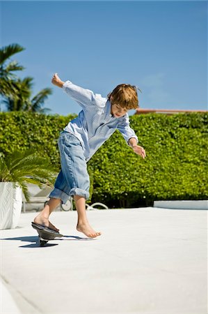 Boy skateboarding Stock Photo - Premium Royalty-Free, Code: 6108-05863027