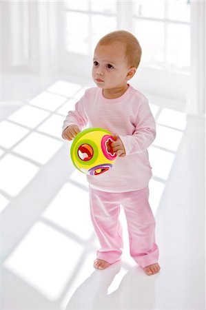 simsearch:6108-05874136,k - Baby girl holding a toy Stock Photo - Premium Royalty-Free, Code: 6108-05863161