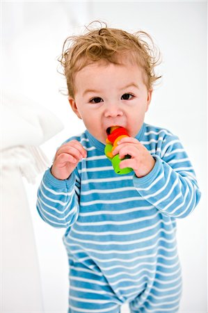 simsearch:6108-05863835,k - Portrait of a baby boy playing with a toy Stock Photo - Premium Royalty-Free, Code: 6108-05863120