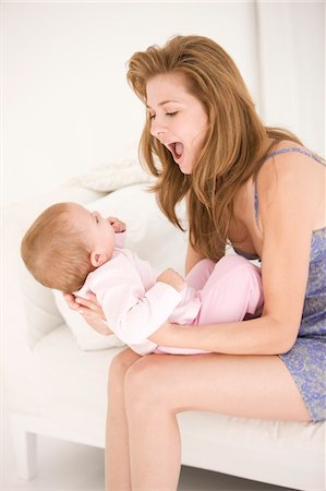 simsearch:6108-05865897,k - Woman playing with her daughter Stock Photo - Premium Royalty-Free, Code: 6108-05863208