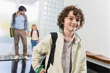 door education - Man entering the house with his children Stock Photo - Premium Royalty-Free, Code: 6108-05863398