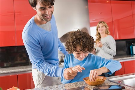 family playing in the kitchen - Family in the kitchen Stock Photo - Premium Royalty-Free, Code: 6108-05863455