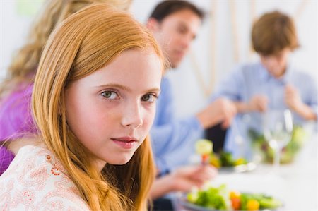 simsearch:6108-05863428,k - Portrait of a girl at a dining table Stock Photo - Premium Royalty-Free, Code: 6108-05863459