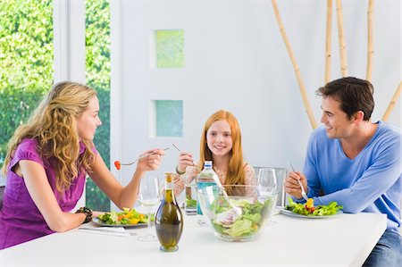 red hair daughter with mom - Family having lunch Stock Photo - Premium Royalty-Free, Code: 6108-05863461