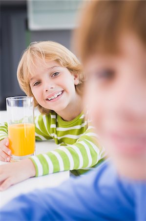 simsearch:6108-05864959,k - Boy holding a glass of juice Stock Photo - Premium Royalty-Free, Code: 6108-05863466