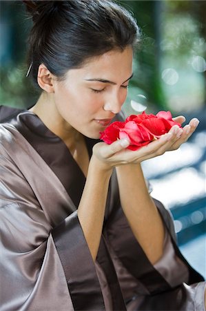 simsearch:6108-05874116,k - Woman smelling rose flowers Stock Photo - Premium Royalty-Free, Code: 6108-05863484