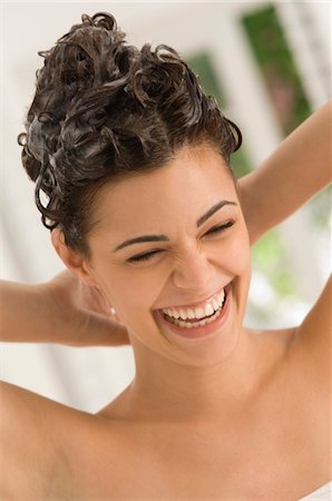 Close-up of a woman shampooing her hair Stock Photo - Premium Royalty-Free, Code: 6108-05863588