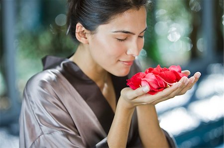 smelling hair - Woman smelling rose flowers Stock Photo - Premium Royalty-Free, Code: 6108-05863512