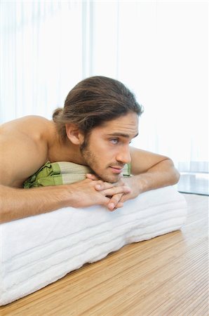 drapery - Man lying on a massage table Stock Photo - Premium Royalty-Free, Code: 6108-05863533