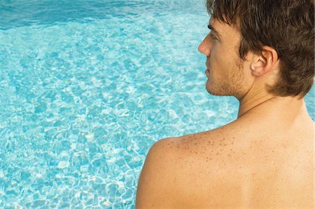 simsearch:6108-05863886,k - Close-up of a man at the poolside Stock Photo - Premium Royalty-Free, Code: 6108-05863759
