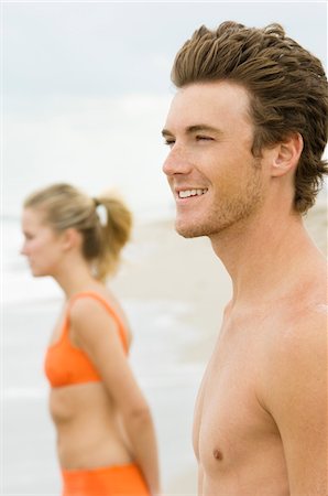 Couple standing on the beach Stock Photo - Premium Royalty-Free, Code: 6108-05863962