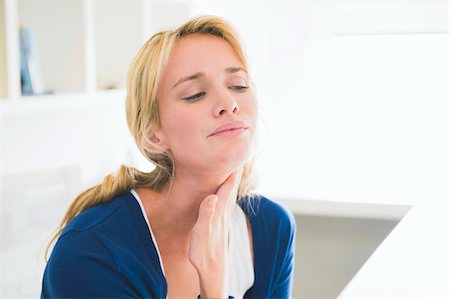 pain (emotional) - Close-up of a woman touching her throat Stock Photo - Premium Royalty-Free, Code: 6108-05864272