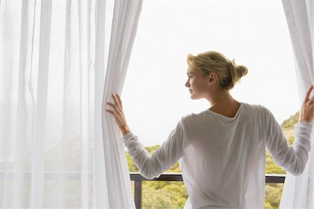 drapery - Rear view of a woman standing on balcony Stock Photo - Premium Royalty-Free, Code: 6108-05864369