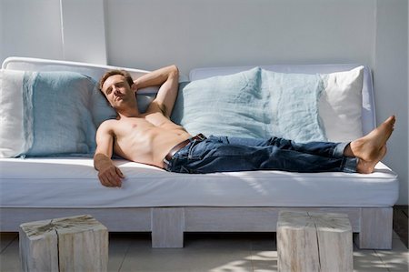 relax man face - Man resting on a couch Stock Photo - Premium Royalty-Free, Code: 6108-05865042