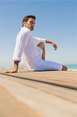 Man sitting on the beach Fotografie stock - Premium Royalty-Free, Codice: 6108-05865047