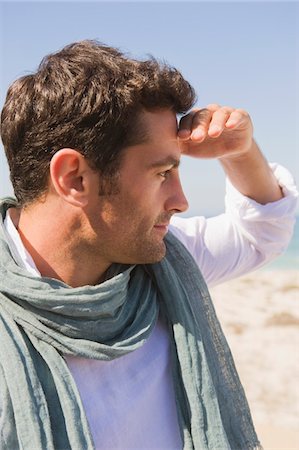 far away - Close-up of a man on the beach Stock Photo - Premium Royalty-Free, Code: 6108-05865009