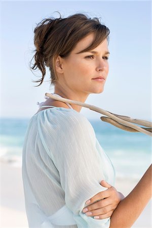 simsearch:6108-05874310,k - Woman standing on the beach and thinking Stock Photo - Premium Royalty-Free, Code: 6108-05865249