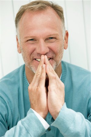 Portrait of a man smiling Stock Photo - Premium Royalty-Free, Code: 6108-05865315