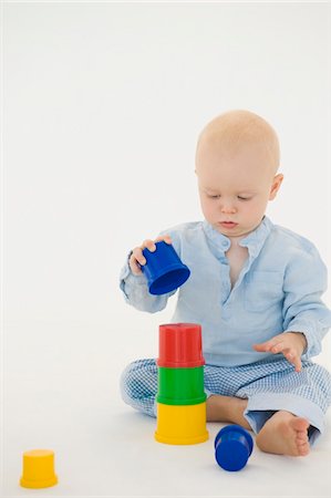 Baby boy stacking blocks Stock Photo - Premium Royalty-Free, Code: 6108-05865639