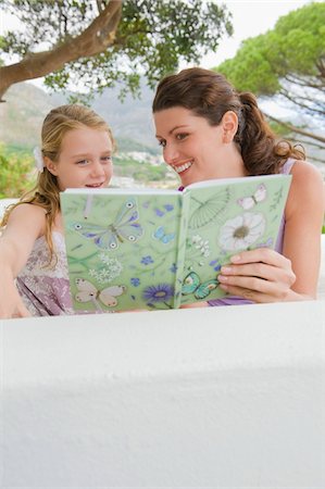 Woman teaching her daughter Stock Photo - Premium Royalty-Free, Code: 6108-05865854