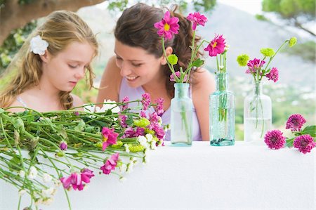 Woman smiling with her daughter Stock Photo - Premium Royalty-Free, Code: 6108-05865866