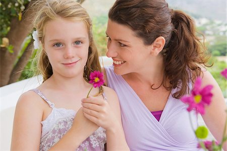 simsearch:6108-05865897,k - Woman smiling with her daughter Stock Photo - Premium Royalty-Free, Code: 6108-05865880