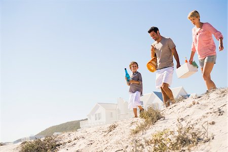 family walk sand - Family on vacations on the beach Stock Photo - Premium Royalty-Free, Code: 6108-05866023