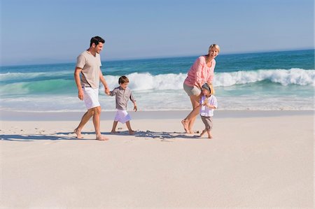 simsearch:6108-05865934,k - Family enjoying vacations on the beach Stock Photo - Premium Royalty-Free, Code: 6108-05866027