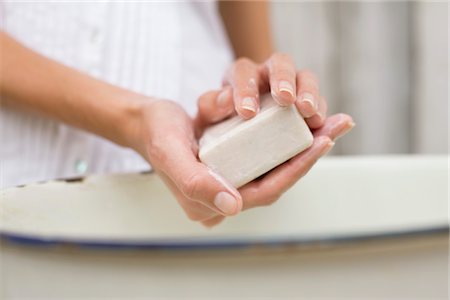Woman washing hands with a soap Stock Photo - Premium Royalty-Free, Code: 6108-05866165