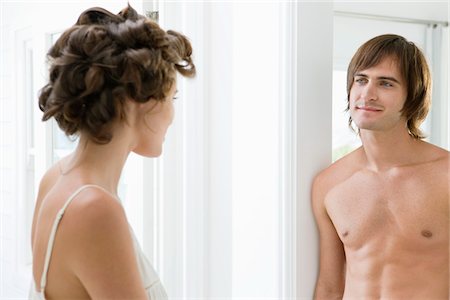 simsearch:6108-05865507,k - Couple looking at each other Stock Photo - Premium Royalty-Free, Code: 6108-05866215