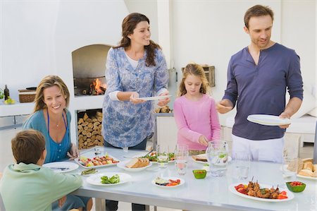 simsearch:640-01358563,k - Family having breakfast at the dining table Stock Photo - Premium Royalty-Free, Code: 6108-05866359