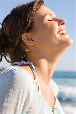 Close-up of a woman smiling Stock Photo - Premium Royalty-Free, Code: 6108-05866545