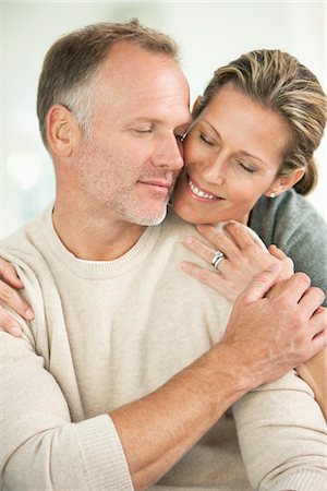 Close-up of a couple romancing Stock Photo - Premium Royalty-Free, Code: 6108-05866628