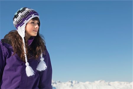 Teenage girl in ski-wear day dreaming Stock Photo - Premium Royalty-Free, Code: 6108-05866983