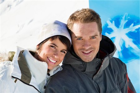 simsearch:6108-05866881,k - Young couple in winter clothes smiling at camera Stock Photo - Premium Royalty-Free, Code: 6108-05866927