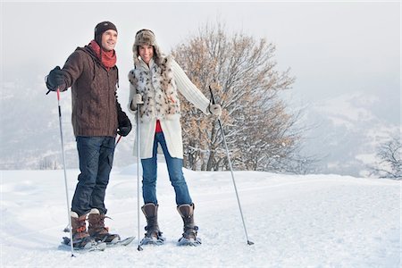 pictures of man snowshoeing - Young couple snowshoeing Stock Photo - Premium Royalty-Free, Code: 6108-05867021