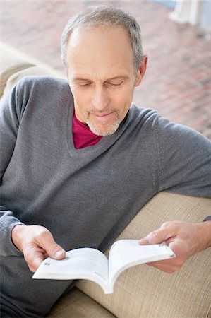 Man reading a book Stock Photo - Premium Royalty-Free, Code: 6108-05867463