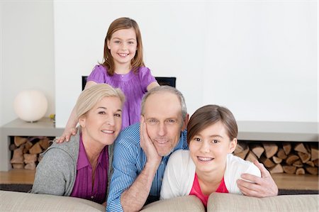 simsearch:640-03256069,k - Couple smiling with their granddaughters Stock Photo - Premium Royalty-Free, Code: 6108-05867565