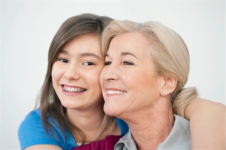 simsearch:6108-05867579,k - Close-up of a woman smiling with her granddaughter Stock Photo - Premium Royalty-Free, Code: 6108-05867581