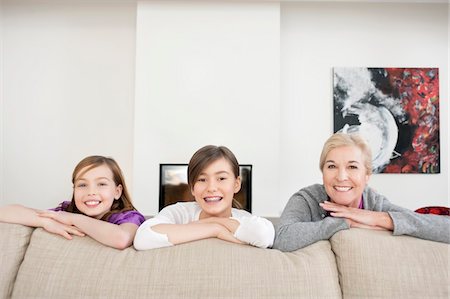 simsearch:6108-05867579,k - Portrait of a woman smiling with her granddaughters Stock Photo - Premium Royalty-Free, Code: 6108-05867589