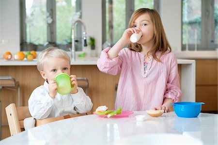 brother and sister drinking milk Stock Photo