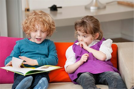 simsearch:632-08227559,k - Boy sitting with his sister and reading a book Stock Photo - Premium Royalty-Free, Code: 6108-05867689