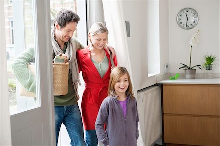 person entering door - Family entering the house Stock Photo - Premium Royalty-Free, Code: 6108-05867602