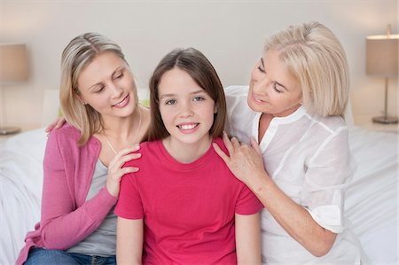 simsearch:6108-05867579,k - Portrait of a girl sitting with her mother and grandmother Stock Photo - Premium Royalty-Free, Code: 6108-05867704